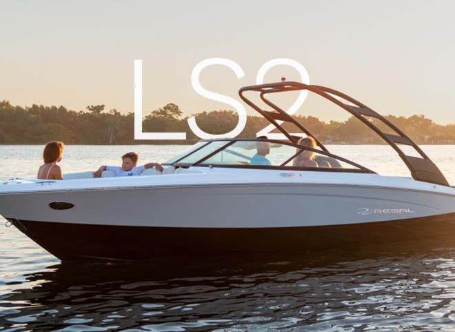 A luxurious Regal Boat cruising on the water, showcasing its sleek design and advanced features