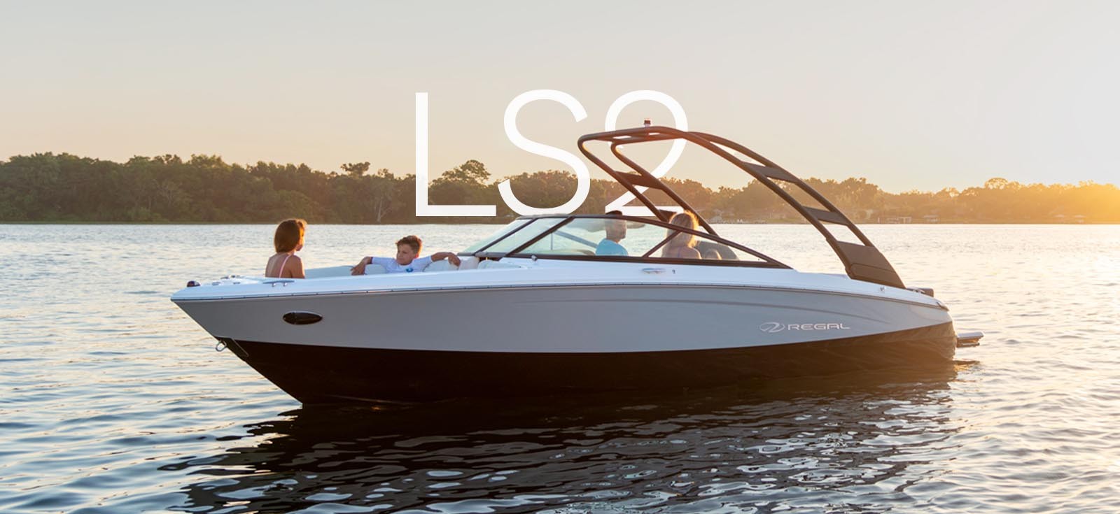 A luxurious Regal Boat cruising on the water, showcasing its sleek design and advanced features.